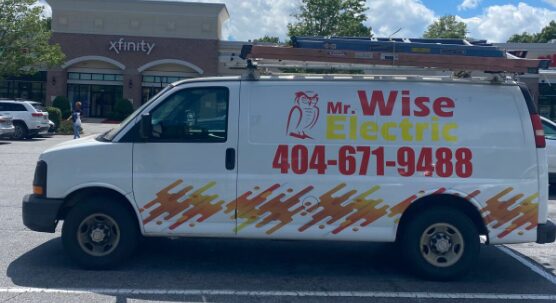 Mr. Wise Electric branded service van at commercial building